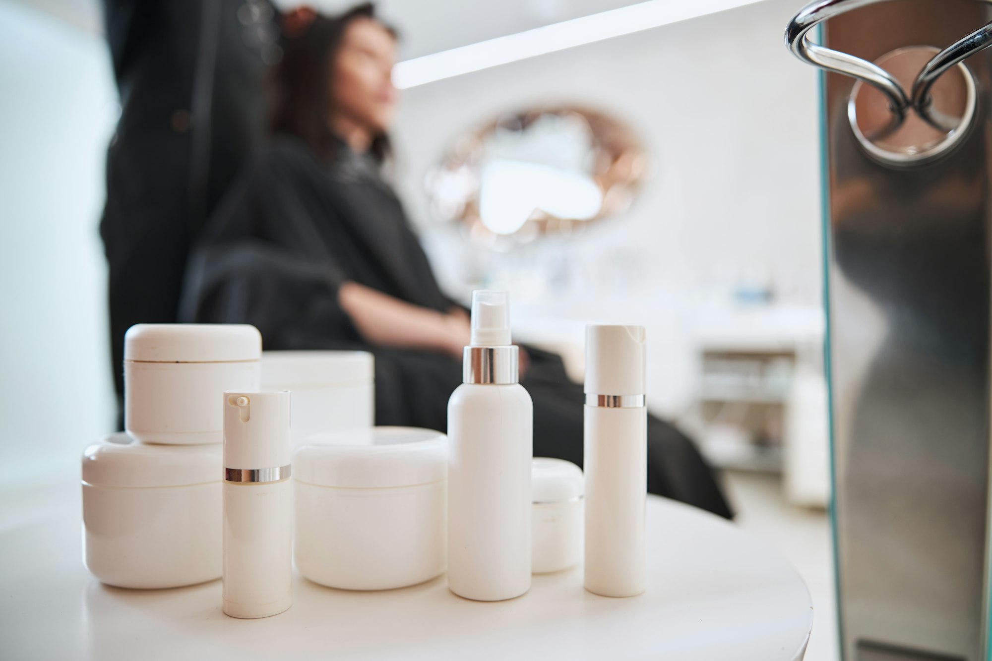 Customer having her hair styled by professional haircare products